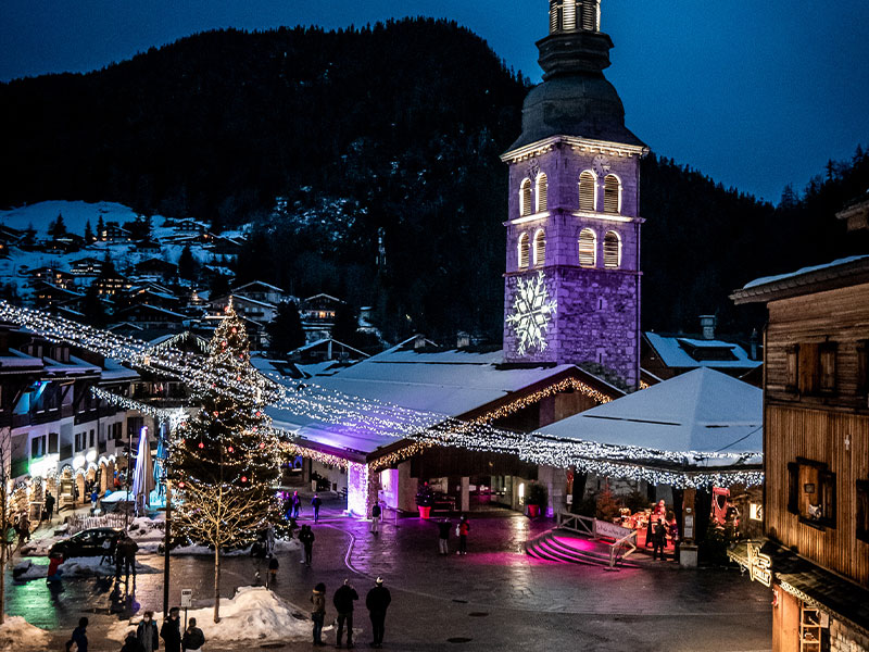 Streets festooned with Christmas lights and decorations, La Clusaz, French Alps