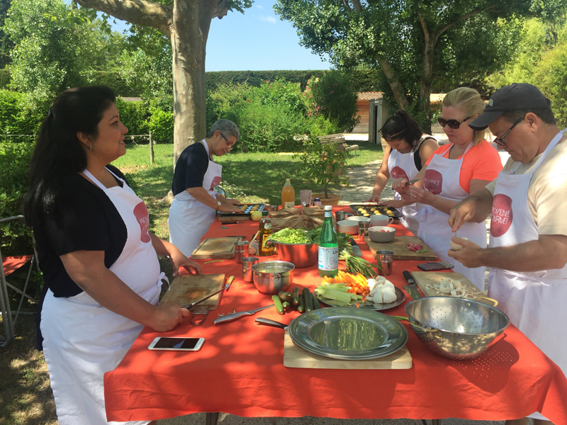 People cooking al fresco in Provence on a tour