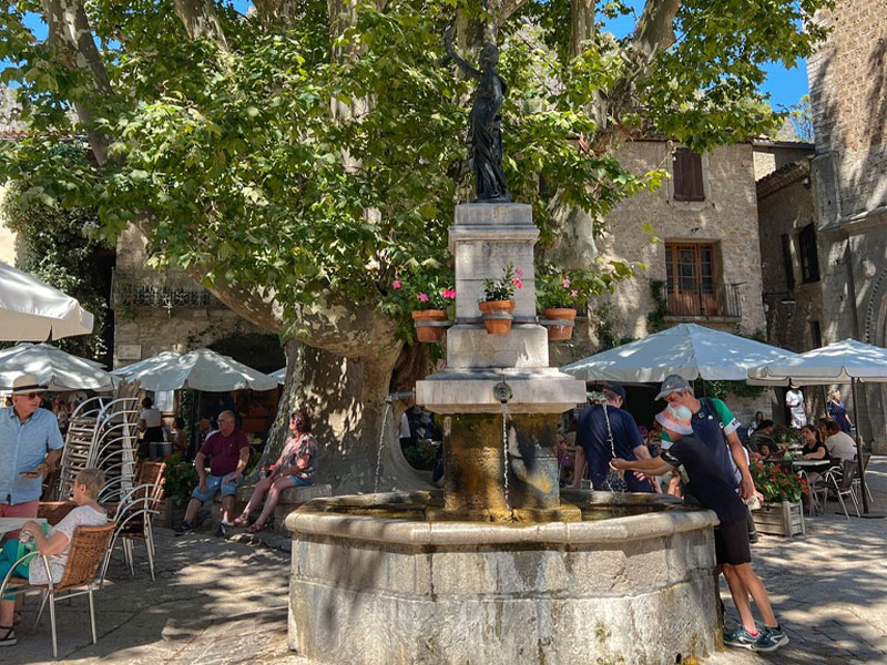 Sunny day in the main square of Saint-Guilhem-le-Desert, southern France