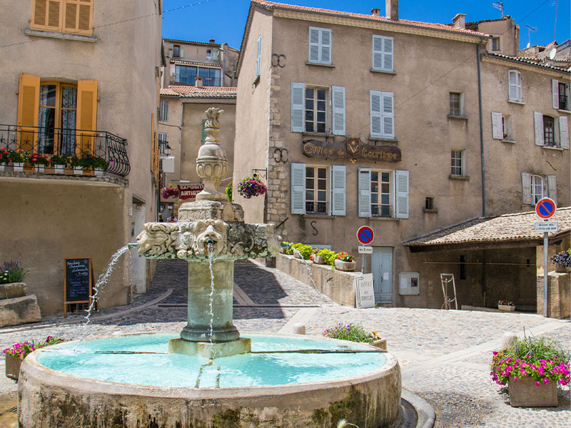 Fountain tinkling in main square of Valensole town, Provence